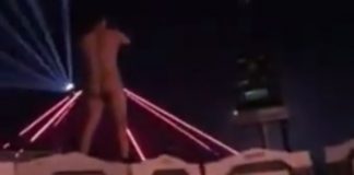 naked dude jumps off festival toilets
